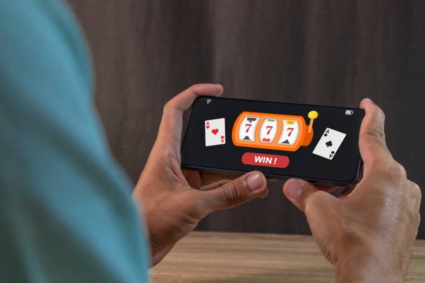 Live roulette studio with dealer and numbered wheel, multi-camera view on mobile screen